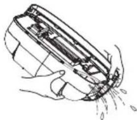 Illustration of hands cleaning a mechanical component with spray, no text or symbols present