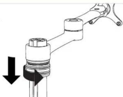 Mechanical component diagram showing a piston and lever assembly with a downward arrow indicating force or direction (no text or symbols present)