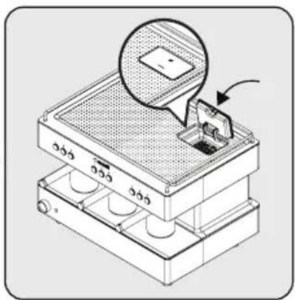 Isometric illustration of a mechanical device with a magnified inset showing a component (no text or symbols)