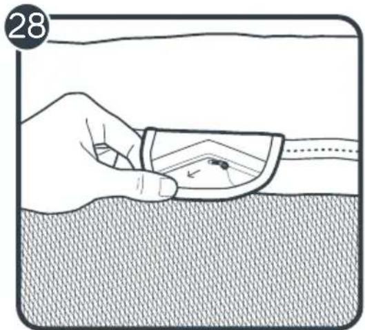 Illustration of a hand holding a small object over a textured surface, with no visible text or symbols.