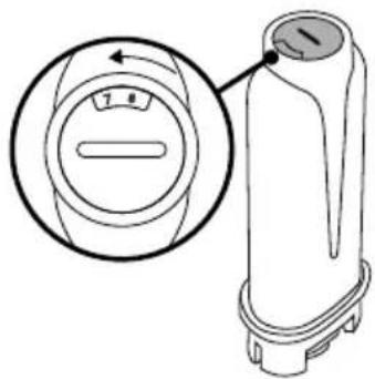 Technical line drawing of a cylindrical device with a dial and control knob, showing internal components (no text or symbols)
