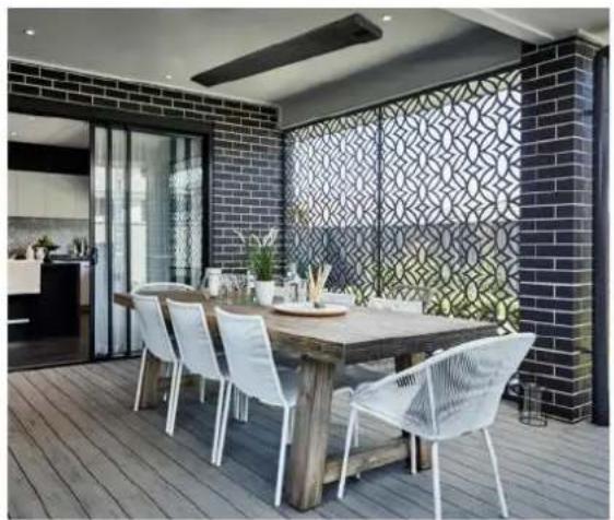 Modern dining area with wooden table, white chairs, and patterned glass partition (no visible text or symbols)