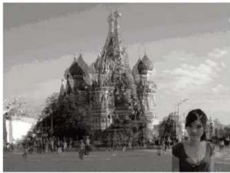 Black-and-white photo of a historic cathedral with a person standing in front (no visible text or signage)