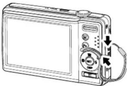 Line drawing of a digital camera with an attached control panel and cable, showing no text or symbols.