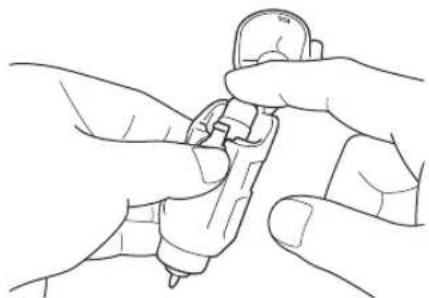 Line drawing of two hands holding a small object, possibly a tool or device (no text or symbols present)