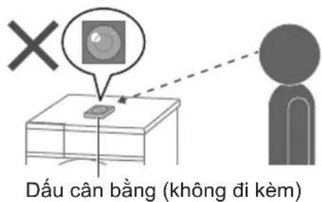 Safety warning illustration showing correct and incorrect matches for washing machines, with checkmarks indicating failure.