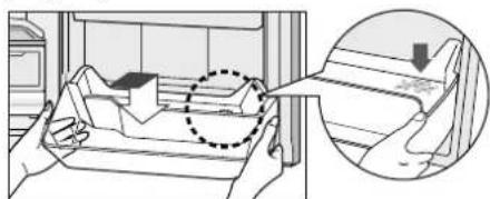 Diagram illustrating a hand holding a device with an arrow and magnified view showing the process, including a dashed circle highlighting a component.