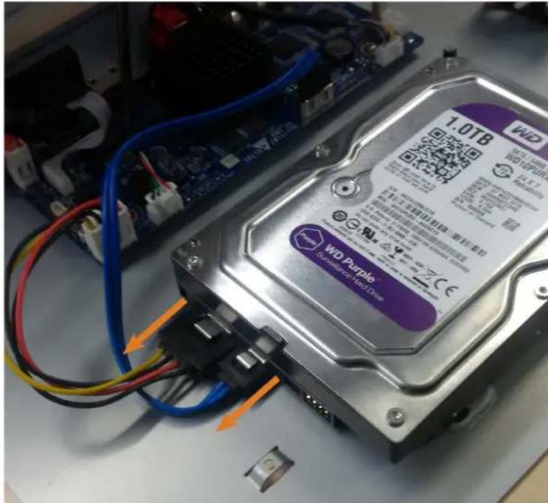Close-up of a WID Purple hard drive with visible circuit board and wiring (no readable text beyond branding)