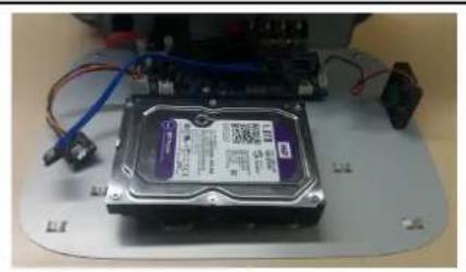Close-up of a CD-ROM drive with visible circuitry and wiring (no text or symbols)