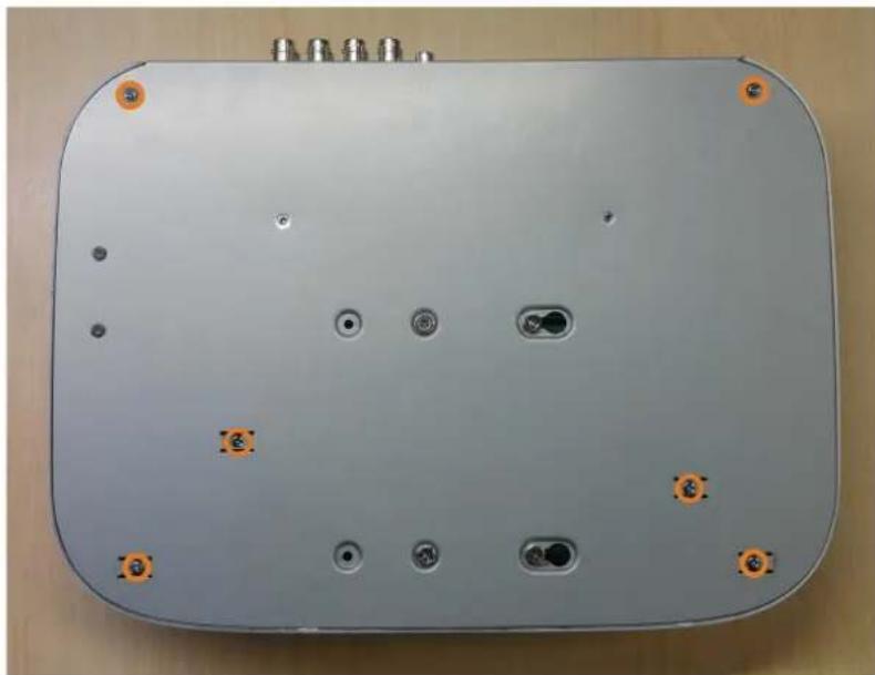 Top-down view of a gray electronic device casing with multiple ports and mounting holes (no visible text or symbols)