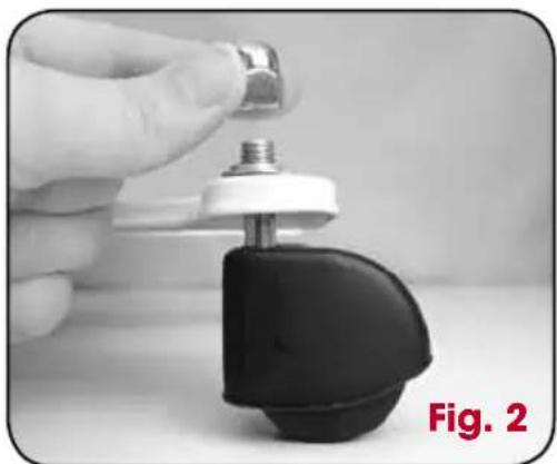 Close-up of a hand holding a metallic implant component with a black base and white cap (no text or symbols visible)