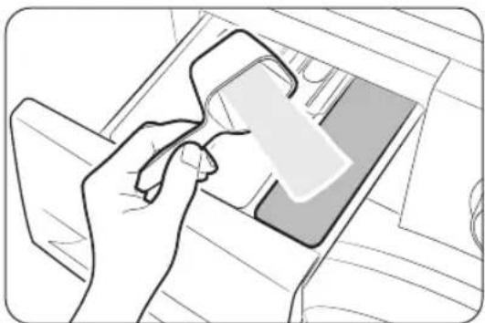 Line drawing of a hand inserting a card into a device (no text or symbols)