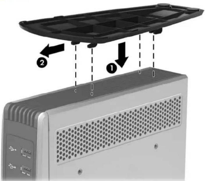 Diagram showing a device with labeled parts, including a black plastic casing and a computer tower with ventilation slots.