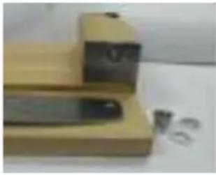 Mellerware Biltong King BC002 - Attach the blade to the bolt extending from the raised wooden block. Position a white nylon washer on either side of the blade and then tighten the Nylon - 1