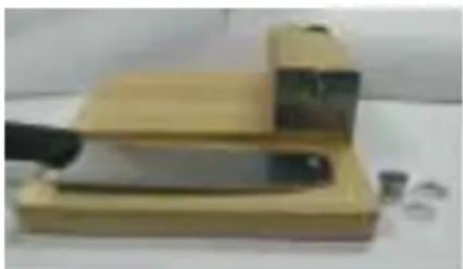 Mellerware Biltong King BC002 - Attach the blade to the bolt extending from the raised wooden block. Position a white nylon washer on either side of the blade and then tighten the Nylon - 6