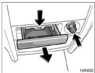 Diagram of a car intake tray with arrows indicating direction of movement (no text or symbols)