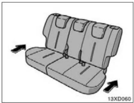 3D illustration of a vehicle rear seat with three seats and side panels, showing directional arrows (no text or symbols)
