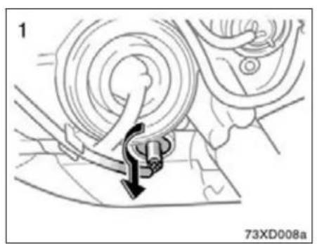 Mechanical assembly diagram showing a rotating component with a downward arrow indicating motion (no text or symbols)