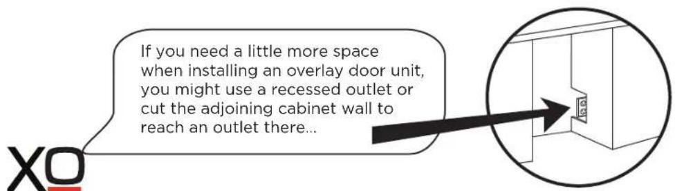 If you need a little more space when installing an overlay door unit, you might use a recessed outlet or cut the adjoining cabinet wall to reach an outlet there...