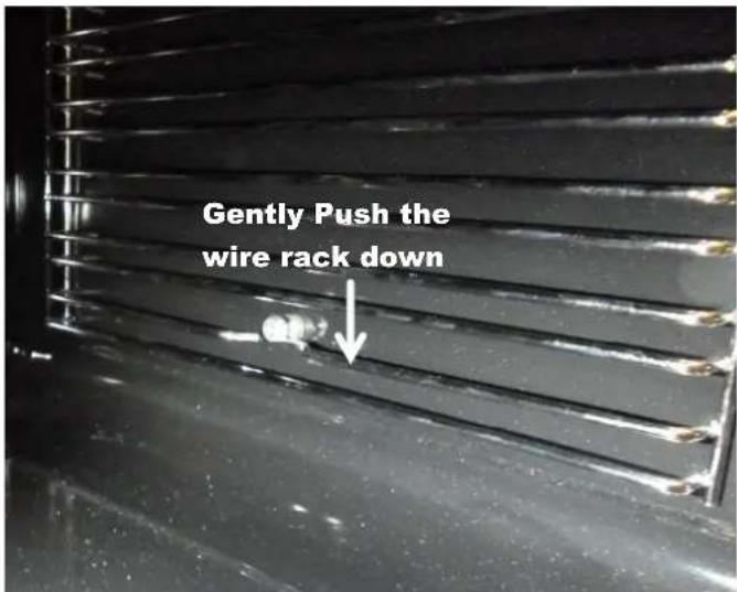 Gently Push the wire rack down