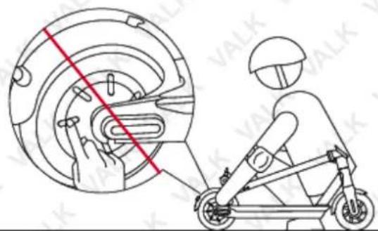 Diagram showing a person riding an electric scooter with a red diagonal line indicating the mechanism, labeled 'VALK' in the corner.
