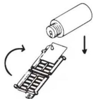 Diagram illustrating a mechanical process with a bottle pouring liquid into a device, showing rotation and downward force direction.