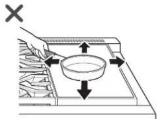Diagram showing a hand using a tool to clean food items with directional arrows indicating flow or movement.