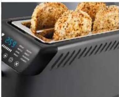 Close-up of a modern toaster with two baked goods on top, no visible text or symbols