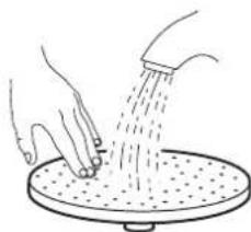 Illustration of hands using a showerhead to spread water onto a circular platform (no text or symbols)