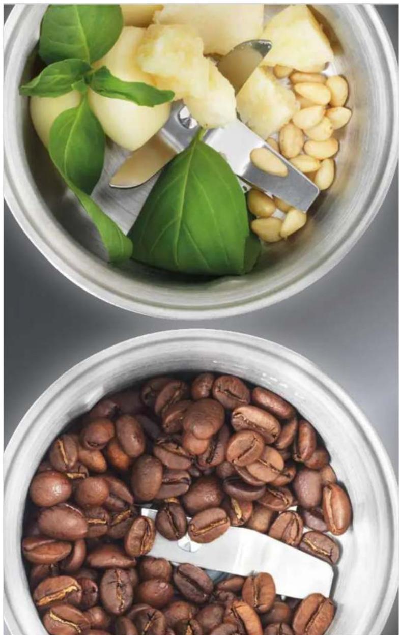 Top-down view of two coffee bowls containing various ingredients: green leafy greens, pineapple slices, and brown beans (no text or symbols visible)