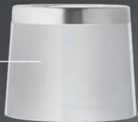 Plain white cylindrical object with a metallic rim, no visible text or markings