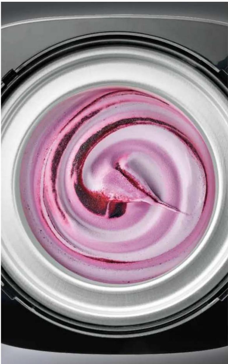 Close-up of a spiral-shaped object with pink and white tones, possibly a decorative or artistic design (no text or symbols visible)