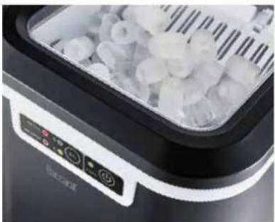 Close-up of a kitchen appliance with digital display and food items inside (no visible text or symbols)
