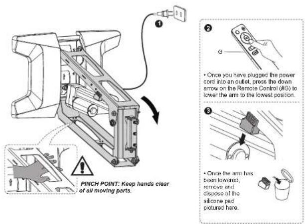 PINCH POINT: Keep hands clear of all moving parts. Once you have plugged the power cord into an outlet, press the down arrow on the Remote Control (#G) to lower the arm to the lowest position. Once the arm has been lowered, remove and dispose of the silicone pad pictured here.