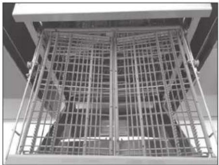 Exterior view of a metal cage structure with grid pattern (no text or symbols visible)
