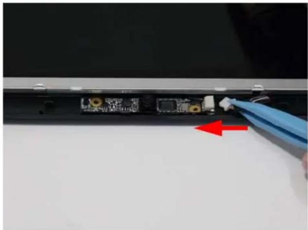 Close-up of a laptop's rear panel showing a circuit board with gold contacts and a blue glove inserted, no visible text or symbols.