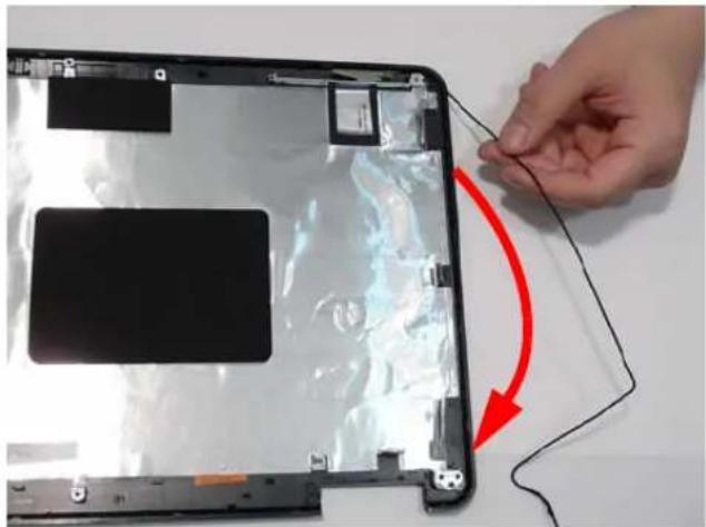 Hand holding a thin wire cable connecting a black cable to a display panel (no text or symbols visible)