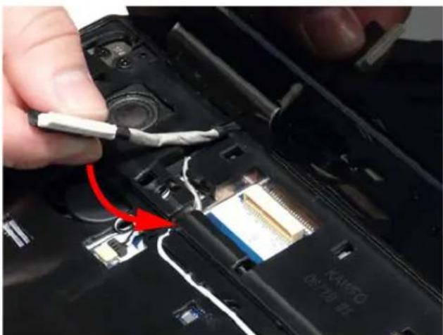 Close-up of a hand holding a white cable with a red arrow pointing to a damaged electronic component (no visible text or symbols)