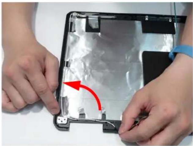 Close-up of hands installing a transparent plastic panel with a red arrow indicating the process (no text or symbols visible)