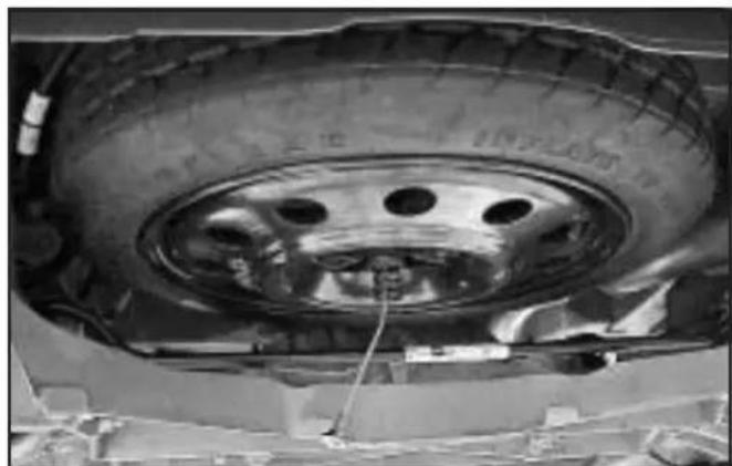 Buick Century (2005) - Removing the Spare Tire (Vehicles without a Rear Convenience Center) - 3