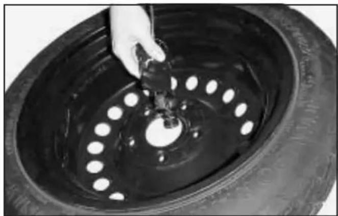 Buick Century (2005) - Removing the Spare Tire (Vehicles with a Rear Convenience Center) - 2
