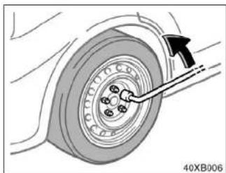 Mechanical diagram showing a wheel with a finger inserted, no text or symbols present