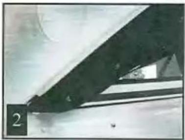 Close-up of a dark, triangular object with a small circular feature and a label '2' in the corner (no readable text or symbols)