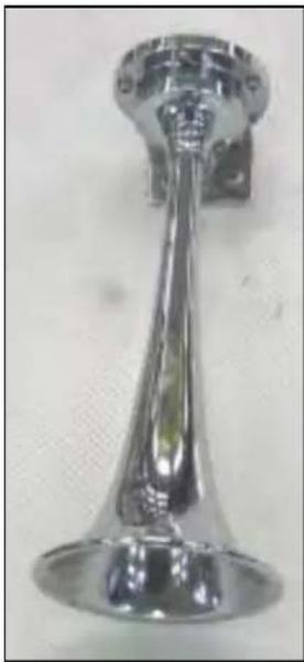 Metallic horn-shaped object with a pointed tip and flared base (no visible text or symbols)