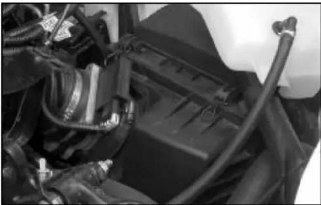 Close-up of mechanical components including hoses and connectors (no visible text or symbols)