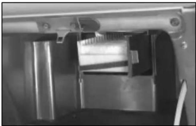 Close-up of a mechanical device interior showing internal components and structural elements (no visible text or symbols)