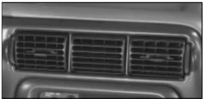 Close-up of a car's front grille with three grilles (no text or symbols visible)