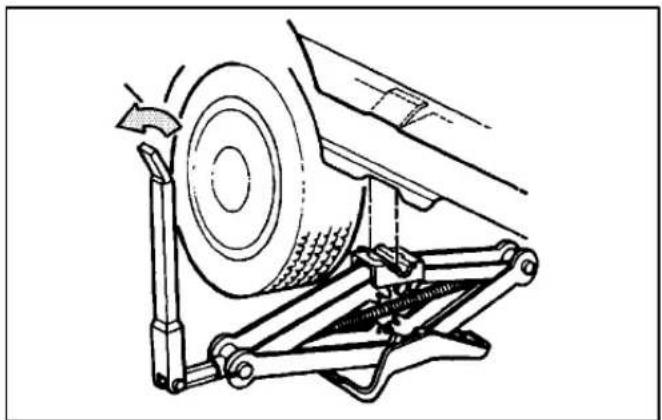 Technical line drawing of a car suspension system with a wheel and attached bracket (no text or symbols)