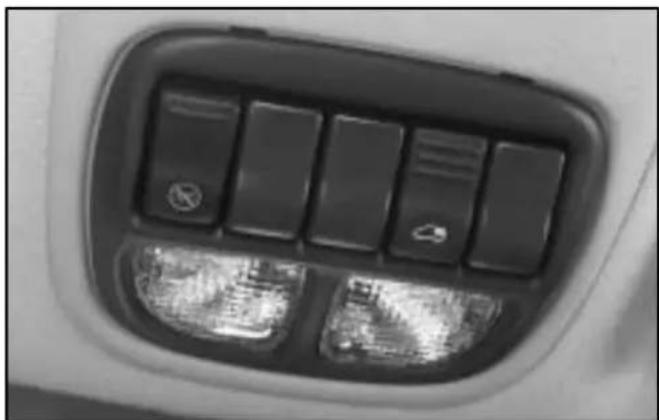 Close-up of a flight suit's back panel with illuminated keys and a small airplane icon (no text or symbols visible)
