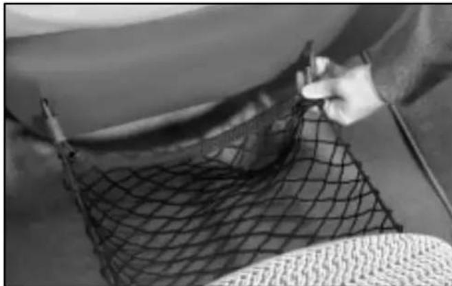 Close-up of a person's arm holding a net, no visible text or symbols